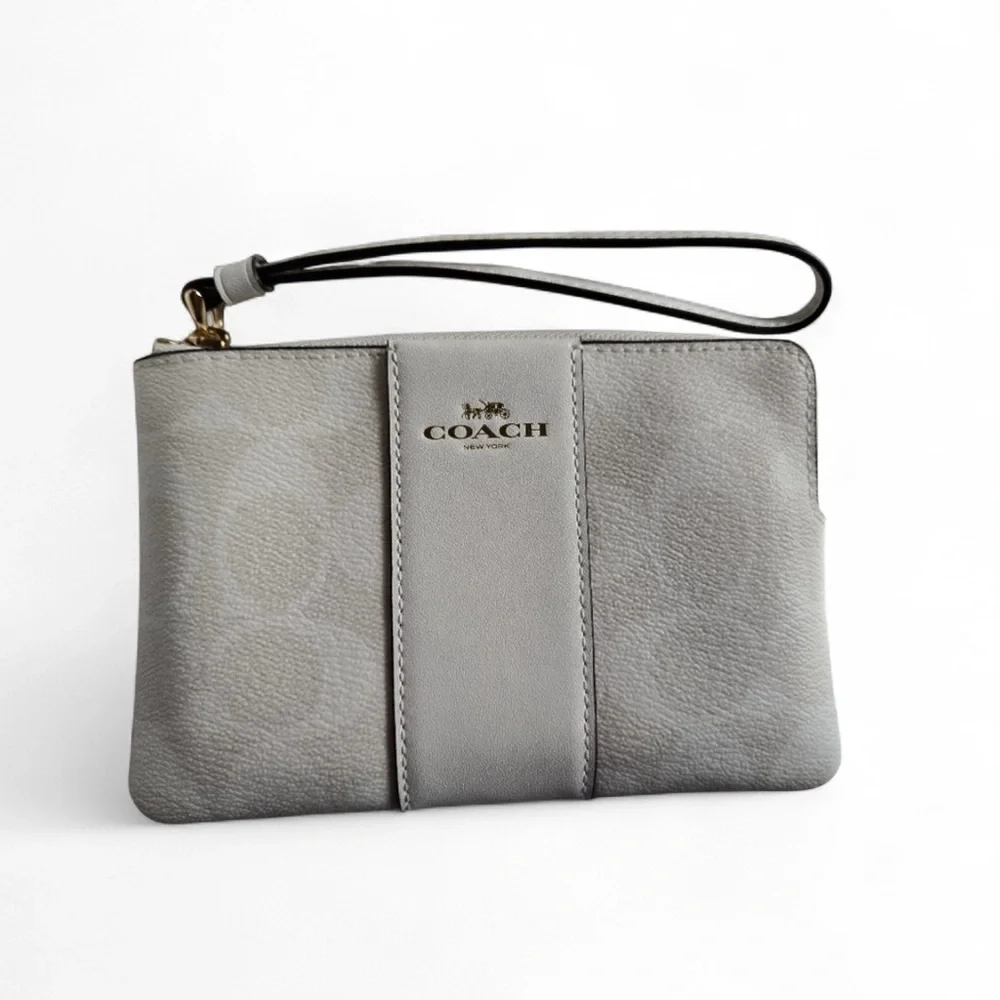 Coach White and Cream Signature Monogrammed Wristlet.